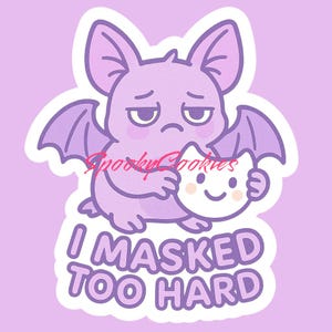 May include: Purple bat cartoon character holding a white cat mask with a sad expression and the text "I MASKED TOO HARD".