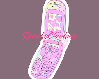 May include: A pink and blue flip phone sticker with a heart pattern on the screen and the text "Spooky Cookies" on the top.