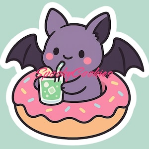May include: A purple bat with black wings is sitting in a pink donut with yellow and blue sprinkles. The bat is holding a green drink with a straw.