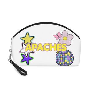 May include: White cosmetic bag with a black zipper and wrist strap. The bag features the word "APACHES" in yellow, along with star, flower, butterfly, and disco ball graphics in various colors.