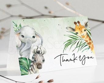 May include: Thank you card featuring a watercolour illustration of a giraffe, elephant and zebra with green leaves. The text "Thank You" is written in black cursive.