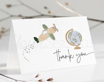 May include: A white thank you card with a watercolor illustration of a small airplane flying towards a globe. The globe has a smiling face and the text "Thank you" is written in black cursive.