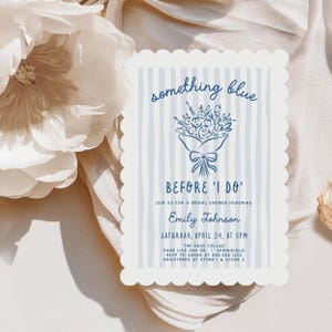 May include: A light blue and white bridal shower invitation with the text "something blue" and "Before I Do". The invitation features a floral bouquet illustration and event details, including the date, time, and honoree's name.