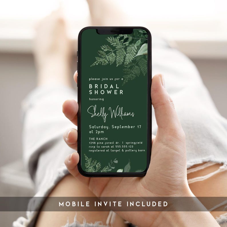 May include: A smartphone displays a bridal shower invitation with a dark green background and botanical accents. The invitation text includes details for Shelly Williams' shower, including the date, time, and location. The words "Mobile Invite Included" are at the bottom.