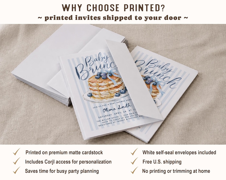 May include: A stack of rectangular baby shower invitations featuring a watercolor illustration of a stack of pancakes with blueberries and a blue ribbon. The text reads Baby Brunch, Olivia Smith, and event details. White envelopes are included with the cards.