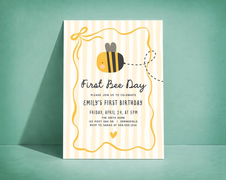 May include: A First Bee Day invitation with a cartoon bee illustration. The invitation has a yellow and white striped background with a yellow border. Text includes "First Bee Day" and details for Emily's first birthday.
