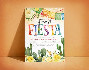 May include: A colorful invitation for a first birthday party. The words "First Fiesta" are displayed in vibrant hues, with floral and cactus illustrations. The invitation includes the date, time, and location of the party.