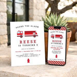 May include: A white invitation and a smartphone showing a birthday party invitation. The invitation and phone screen display a red fire engine graphic and the text "SOUND THE ALARM" and "REESE IS TURNING 3". The invitation includes event details.