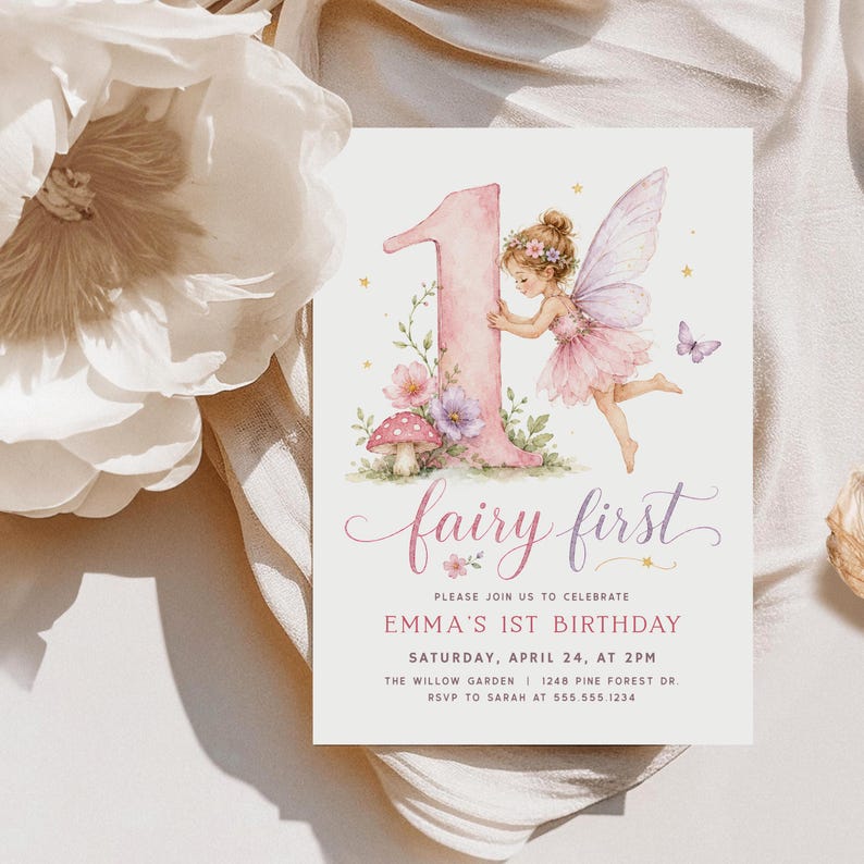 May include: A rectangular birthday invitation card featuring a large pink number one, a watercolor fairy with pink wings, flowers, and a mushroom. The text reads: fairy first, please join us to celebrate Emma's 1st birthday, Saturday, April 24, at 2pm.