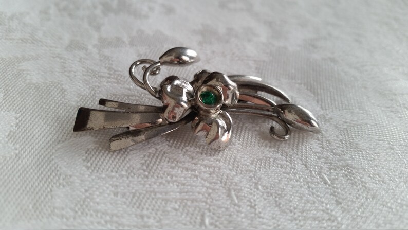 Sterling Silver Bond Boyd pin with green stone