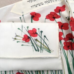 White silk Tallit, with red anemones. Includes a Tallit Bag. Can be ordered with name in Hebrew or English on the back of the bag