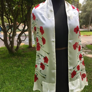 White silk Tallit, with red anemones. Includes a Tallit Bag. Can be ordered with name in Hebrew or English on the back of the bag