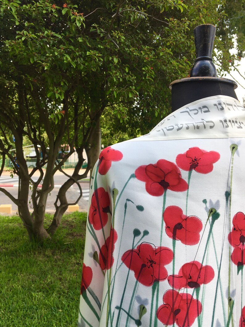White silk Tallit, with red anemones. Includes a Tallit Bag. Can be ordered with name in Hebrew or English on the back of the bag