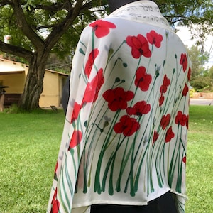 White silk Tallit, with red anemones. Includes a Tallit Bag. Can be ordered with name in Hebrew or English on the back of the bag