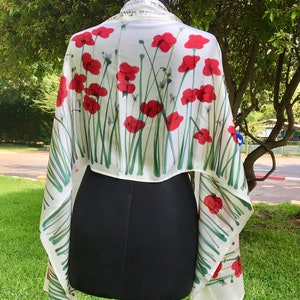White silk Tallit, with red anemones. Includes a Tallit Bag. Can be ordered with name in Hebrew or English on the back of the bag