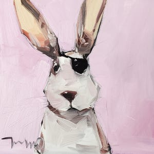 May include: An original oil painting of a white rabbit with a black eye patch and long ears. The rabbit is set against a soft pink background. The artwork is signed in the lower left corner.