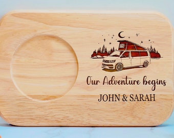 May include: A wooden serving tray with a cutout for a mug. The tray has a laser-engraved design of a camper van in a forest setting with the text "Our Adventure Begins JOHN & SARAH".