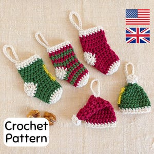 May include: Crochet pattern for a set of five Christmas ornaments: three red and white stockings, one green and white stocking, and one green and white Santa hat.