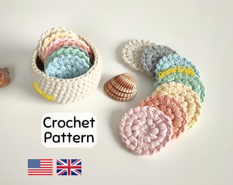 Könnte beinhalten: Ein Set gehäkelter Baumwollrunden in Pastellfarben, darunter Rosa, Pfirsich, Gelb, Grün, Blau und Grau. Die Runden sind in einem Kreis angeordnet, mit einem gehäkelten Korb in der Mitte. Das Bild enthält den Text "Crochet Pattern" und Flaggen für die Vereinigten Staaten und das Vereinigte Königreich.