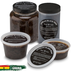 May include: Three containers of African Black Soap by Plant Guru. The soap is a dark brown color and is packaged in a clear plastic jar, a smaller clear plastic container, and a black plastic container. The containers are labeled with the words "African Black Soap" and "Plant Guru". The label also states "100% Natural" and "Product of West Africa".