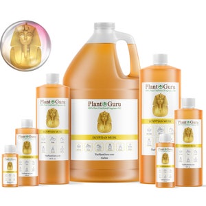 May include: Five bottles of Egyptian Musk fragrance oil in various sizes, from a small 1 oz bottle to a large gallon bottle. The bottles are all amber colored and have a gold label with the text "Plant Guru" and "Egyptian Musk".