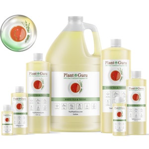 May include: Five bottles of White Tea & Thyme fragrance oil in various sizes, from a small 1/2 oz bottle to a large gallon jug. The bottles are clear and filled with a light yellow liquid. The labels are white with green text and a small image of a cup of tea with a sprig of thyme.