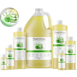 May include: A collection of Plant Guru brand fragrance oil bottles in various sizes, including a gallon jug. The bottles are filled with a light yellow liquid and feature labels with green aloe vera illustrations and the text "Wild Sage & Aloe."