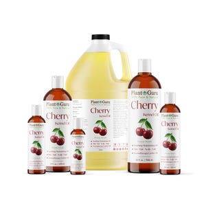 May include: A collection of Plant Guru Cherry Kernel Oil bottles in various sizes. The bottles are amber-colored with white labels and black text. The labels feature a cherry illustration and product information. The largest bottle is a gallon jug.