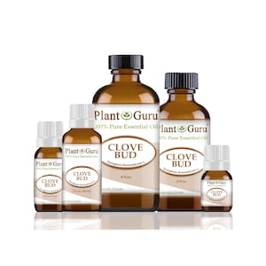 May include: An assortment of amber glass bottles of clove bud essential oil. The bottles vary in size and have black caps and white labels with the text "Plant Guru" and "Clove Bud". The largest bottle is labeled "4 fl oz".