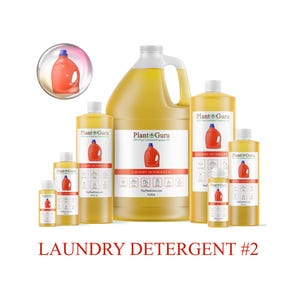 May include: Various sizes of laundry detergent bottles are displayed, ranging from small to a gallon container. The bottles are filled with a yellow liquid and feature a red bottle graphic. The text "Plant Guru" and "Laundry Detergent #2" are visible.