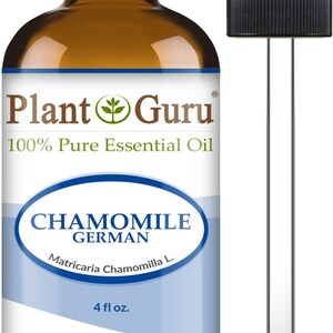 May include: A brown glass bottle of Plant Guru Chamomile German essential oil with a black cap and a dropper. The label reads "100% Pure Essential Oil" and "4 fl oz."