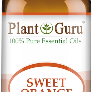 May include: A brown glass bottle of Plant Guru Sweet Orange essential oil. The label includes the text "100% Pure Essential Oils" and "1 fl oz. (30 ml)." The bottle has a white cap.