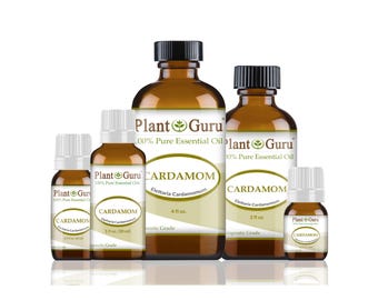 May include: A collection of amber glass bottles of Plant Guru cardamom essential oil. The bottles are of varying sizes, with white labels showing the product name, botanical name, and volume in fluid ounces. The labels also include the text "100% Pure Essential Oil".