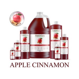 May include: A collection of Plant Guru apple cinnamon fragrance bottles and a gallon jug. Each bottle features a red apple and cinnamon stick graphic. The text "Apple Cinnamon" is displayed below the bottles.