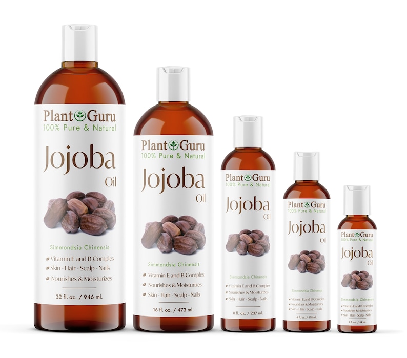 May include: A selection of amber-coloured Plant Guru Jojoba Oil bottles, from 60 ml to 946 ml, are arranged. Each bottle has a white label with the brand name, product name, and a jojoba seed graphic. The labels also list benefits and ingredients.