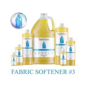 May include: A collection of yellow fabric softener bottles of varying sizes, labeled "Plant Guru Fabric Softener #3." The bottles feature a blue jug icon and are arranged against a white background. The largest bottle is a gallon size.