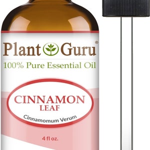 May include: A brown glass bottle of Plant Guru Cinnamon Leaf essential oil with a black cap and a dropper. The label reads "100% Pure Essential Oil" and "Cinnamon Leaf". The bottle contains 4 fl oz of oil.