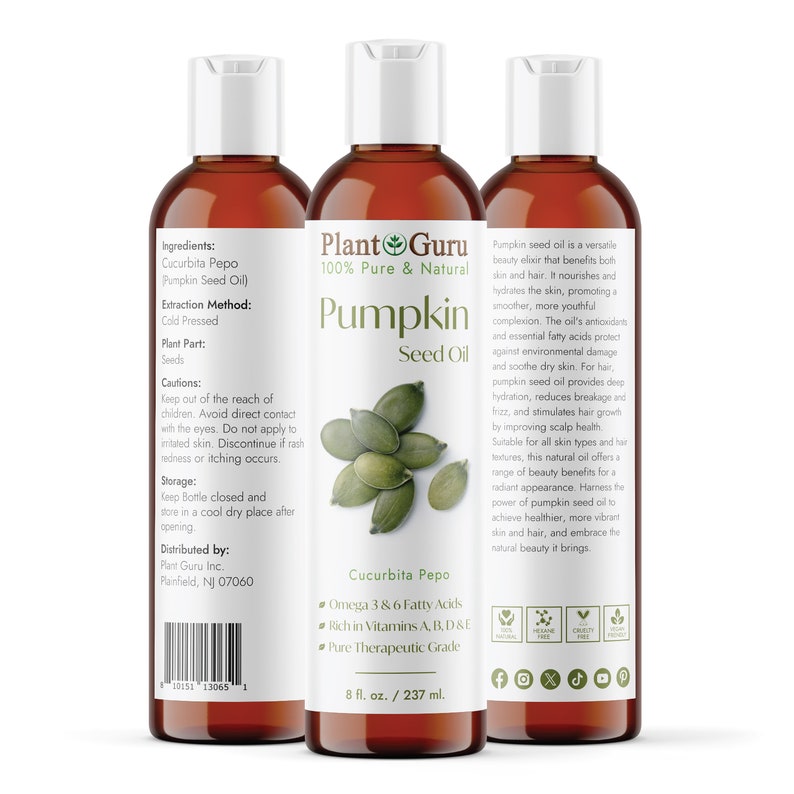May include: Three amber-colored bottles of Plant Guru Pumpkin Seed Oil. Each bottle has a white cap and a label with text and a graphic of pumpkin seeds. The bottles are 8 fl oz / 237 ml.