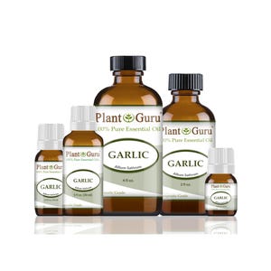 May include: A collection of amber glass bottles of garlic essential oil. The bottles vary in size, from small dropper bottles to larger bottles labeled with "GARLIC" and "Plant Guru 100% Pure Essential Oil".