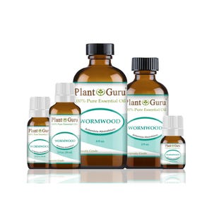 May include: A collection of brown glass bottles of Wormwood essential oil, labeled with the brand "Plant Guru." The bottles vary in size, with white labels and black caps. The labels include the text "Artemisia Absinthium."