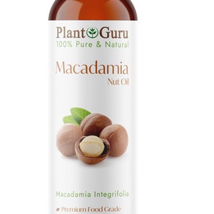 以下が含まれることがあります： Plant Guruのマカダミアナッツオイルの茶色のボトル。ラベルには「100％ Pure & Natural」の文字とマカダミアナッツのグラフィックが描かれています。ボトルには237 mlのオイルが入っており、肌、髪、頭皮、爪に適しています。