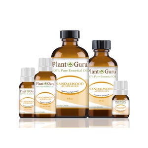 May include: An assortment of amber glass bottles of sandalwood essential oil. The bottles vary in size and have black caps and white labels with the text "Plant Guru" and "Sandalwood Australian". The labels also indicate the volume of each bottle.