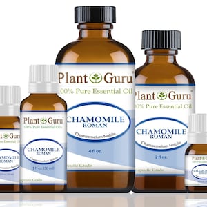 May include: Four amber glass bottles of Roman Chamomile essential oil, labeled "Plant Guru 100% Pure Essential Oils" with varying sizes: 1/3 fl oz, 1 fl oz, 2 fl oz, and 4 fl oz.  All bottles have white caps and are labeled "Chamomile Roman Chamaemelum Nobile" with a green leaf logo.