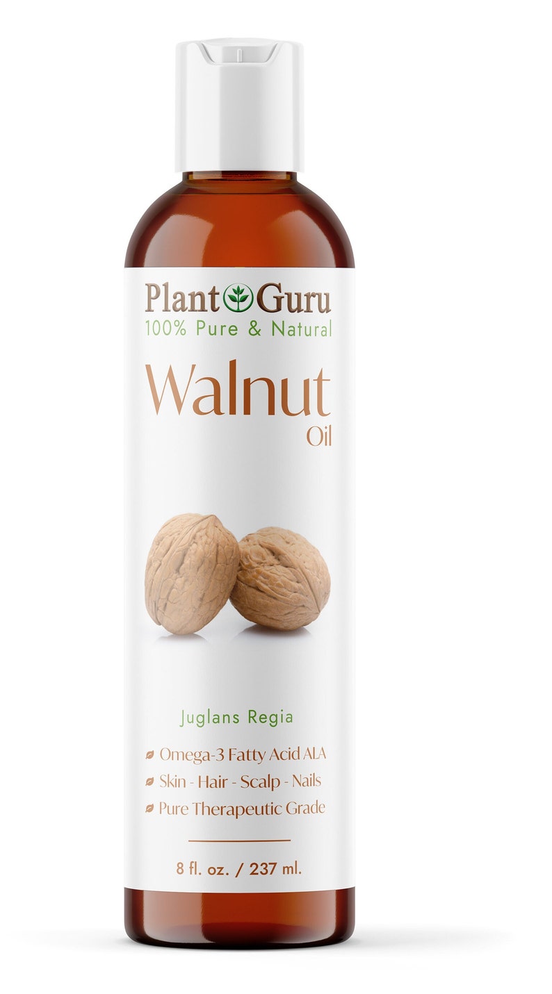 May include: A brown glass bottle with a white cap, labeled "Plant Guru 100% Pure & Natural Walnut Oil". The bottle contains walnut oil and has a label with the botanical name "Juglans Regia", and lists the benefits of the oil, including omega-3 fatty acids, skin, hair, scalp, and nails. The bottle is 8 fluid ounces or 237 milliliters.