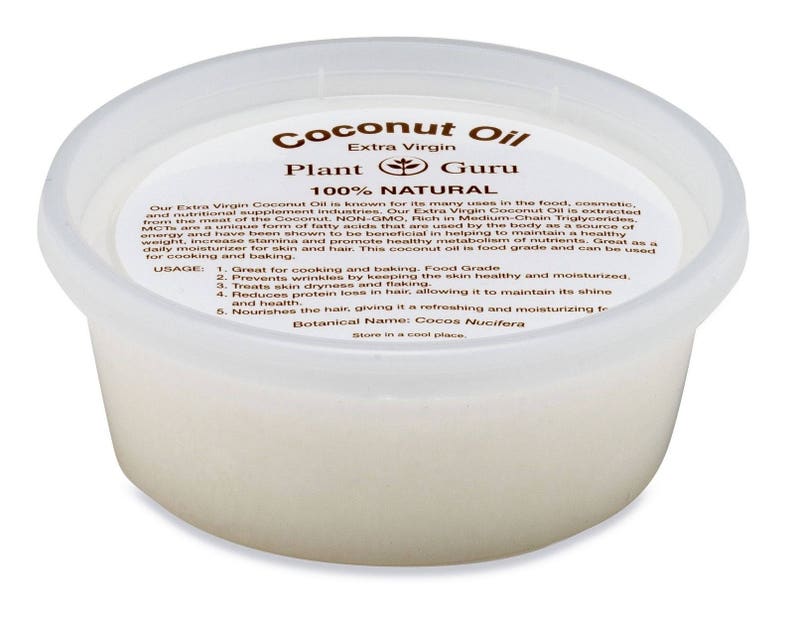 May include: A white plastic container of extra virgin coconut oil labeled "Coconut Oil" with the words "Plant Guru" and "100% Natural" printed on the label. The label also includes the botanical name "Cocos Nucifera" and instructions for usage.