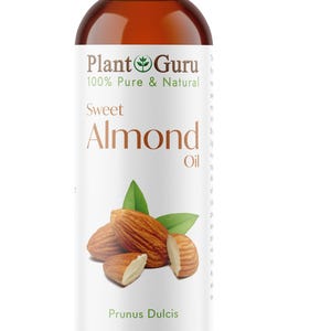 May include: A brown bottle of Plant Guru Sweet Almond Oil. The label features the text "100% Pure & Natural" and "Sweet Almond Oil." The bottle also displays an illustration of almonds and leaves. The bottle contains 8 fl. oz. / 237 ml.