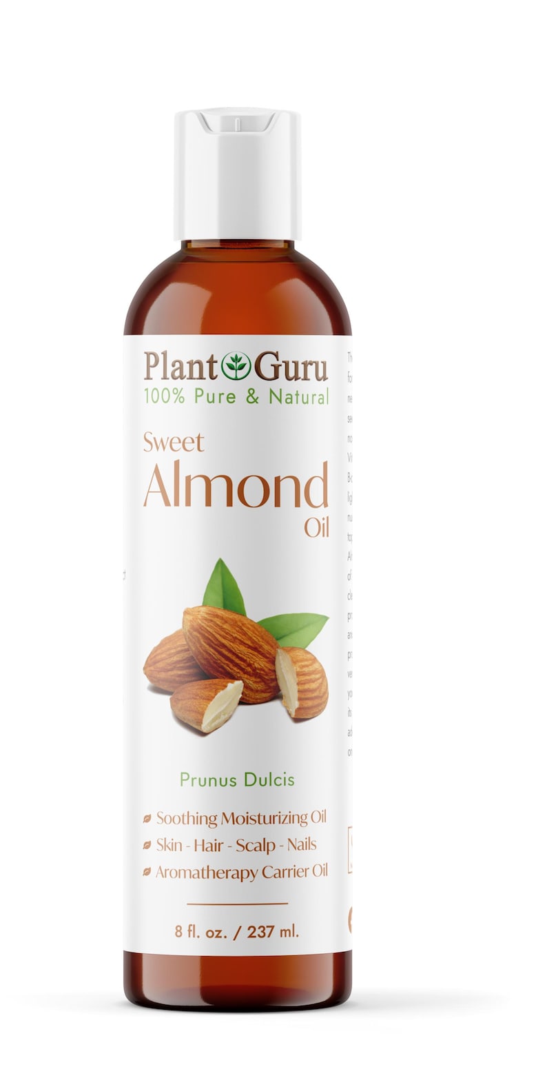 May include: A brown bottle of Plant Guru Sweet Almond Oil. The label features the text "100% Pure & Natural" and "Sweet Almond Oil." The bottle also displays an illustration of almonds and leaves. The bottle contains 8 fl. oz. / 237 ml.