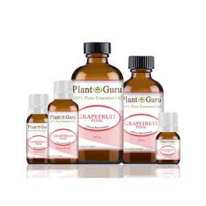 May include: A collection of amber glass bottles and vials of grapefruit pink essential oil. The bottles have black caps and white labels with pink text that reads "Grapefruit Pink Citrus Racemosa". The brand name "Plant Guru" is also visible.