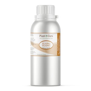May include: A silver metal bottle with a white cap, labeled "Plant Guru" and "Ylang Ylang." The label also includes "Caranga Odorata" and "8 oz." The bottle is for therapeutic grade essential oils.