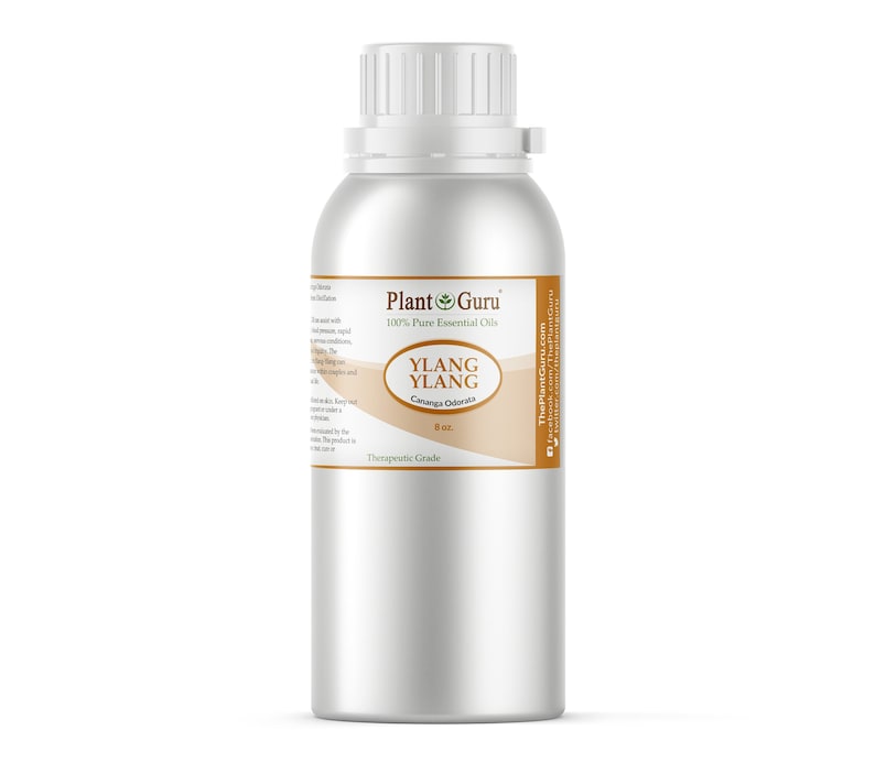 May include: A silver metal bottle with a white cap, labeled "Plant Guru" and "Ylang Ylang." The label also includes "Caranga Odorata" and "8 oz." The bottle is for therapeutic grade essential oils.